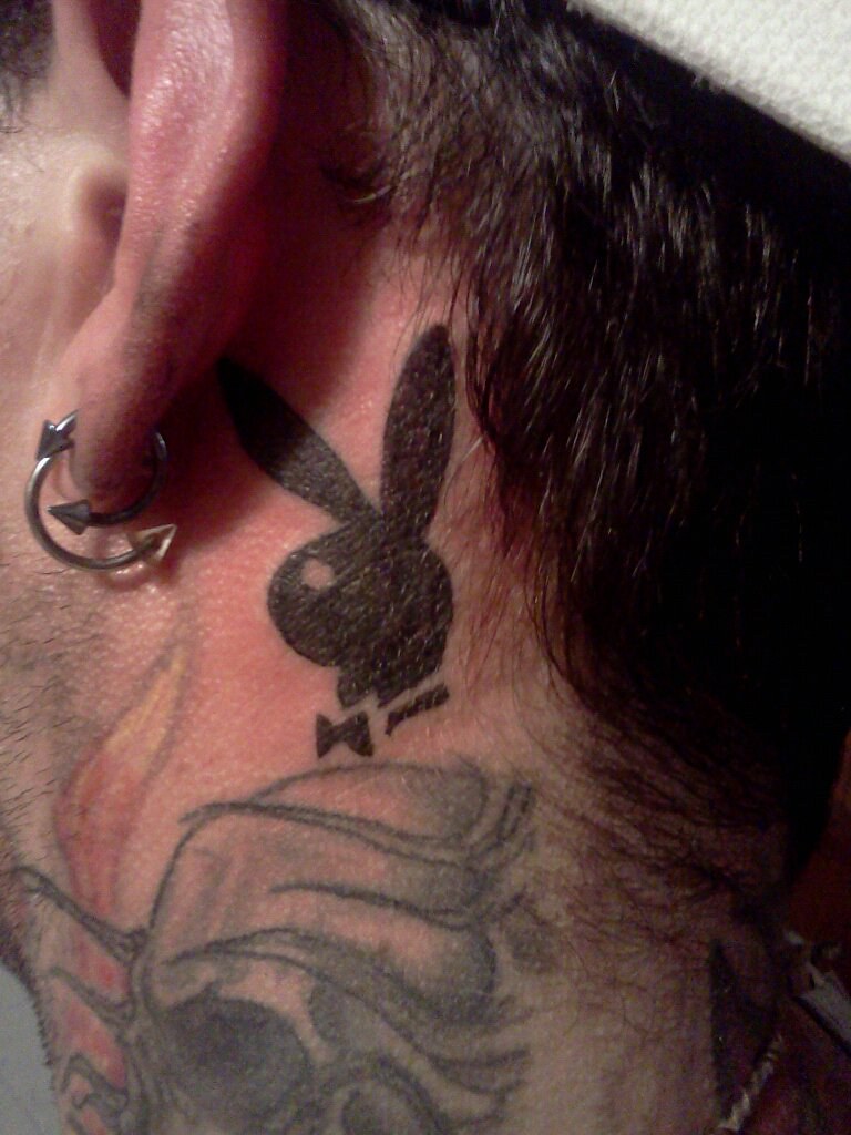playboy tattoo behind ear
