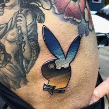 playboy tattoo behind ear