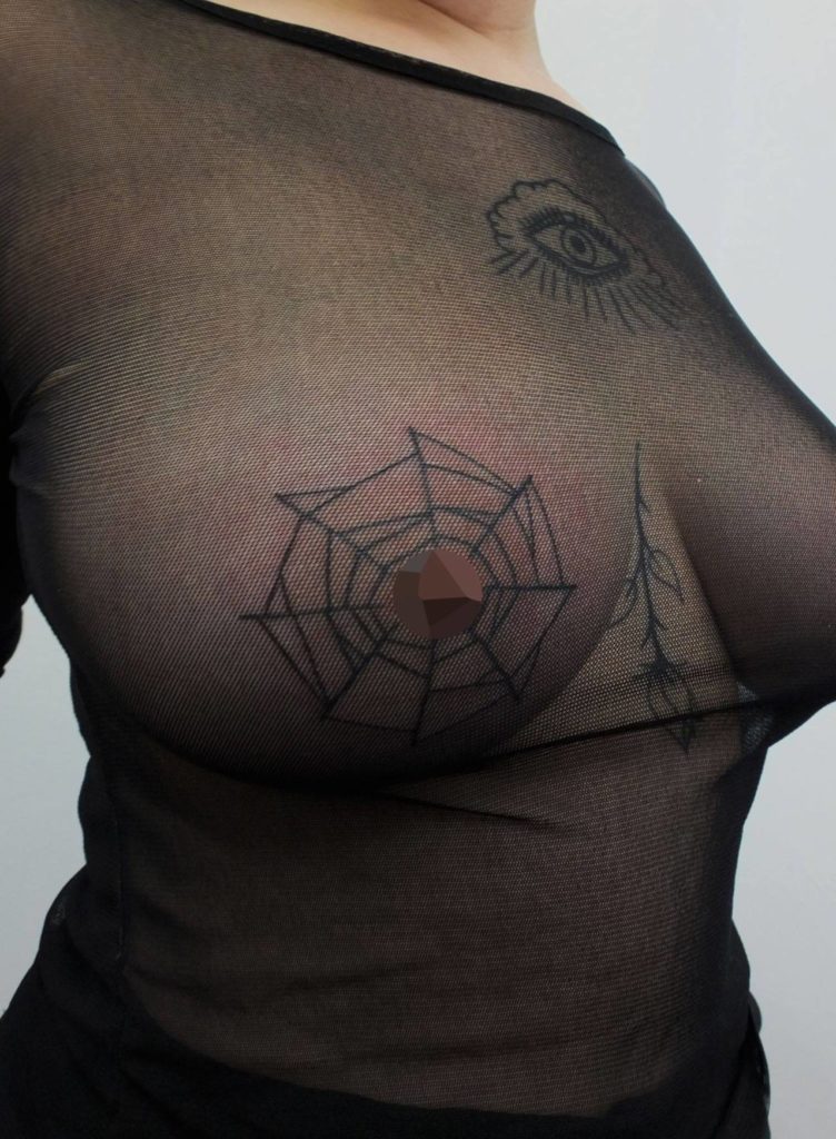 spider web nipple tattoo
