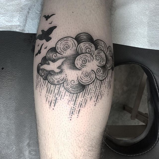 black cloud tattoo and piercing