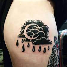 black cloud tattoo and piercing