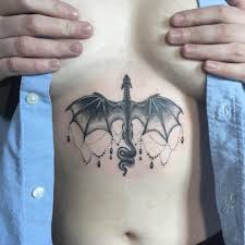 dragon sternum tattoo