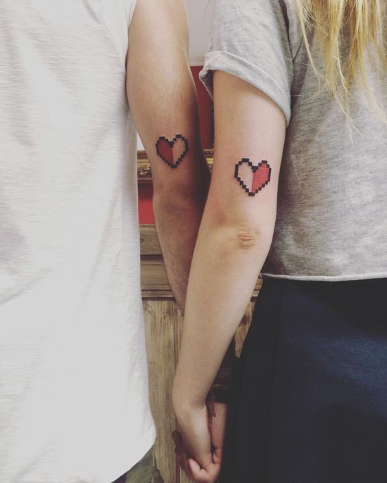 Matching heart tattoos