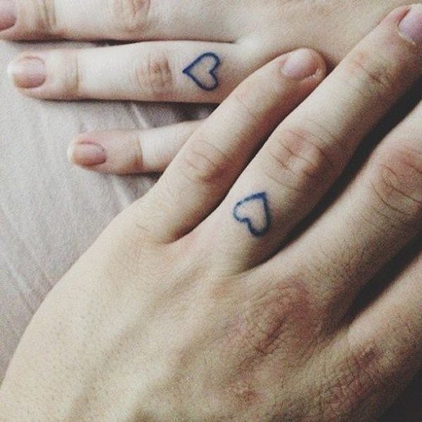 Matching heart tattoos 