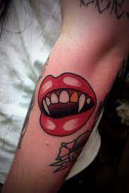 vampire teeth tattoo