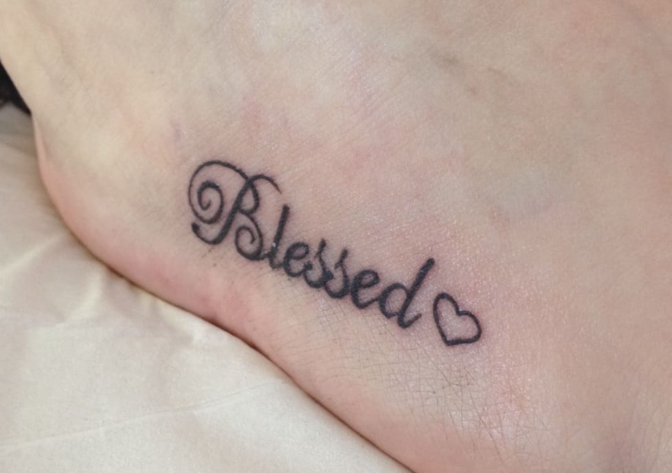 blessed tattoo on wrist
