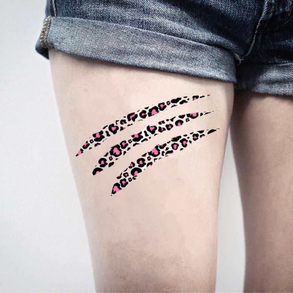cheetah print tattoo on thigh