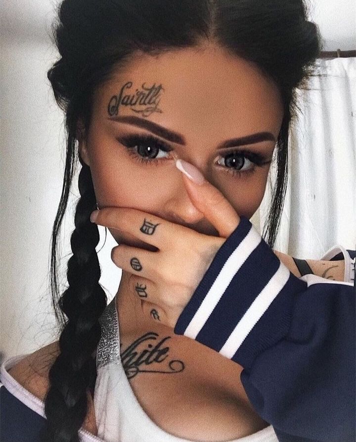 small tattoo above eyebrow