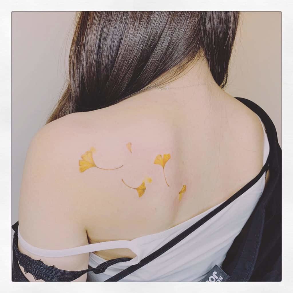 yellow ink tattoo