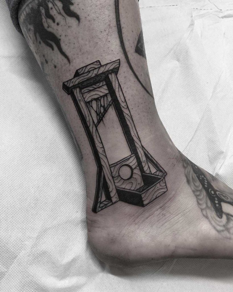 guillotine tattoo