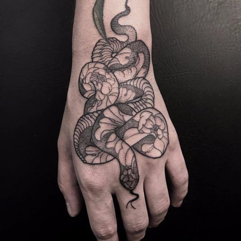 snake bite tattoo