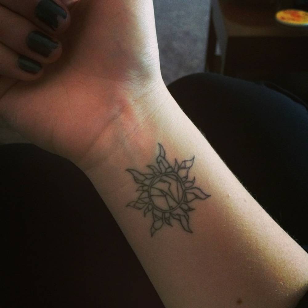 tangled sun tattoo