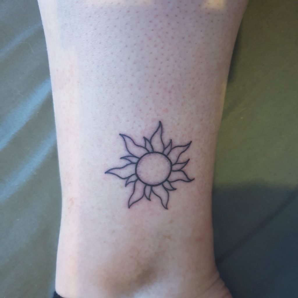 tangled sun tattoo