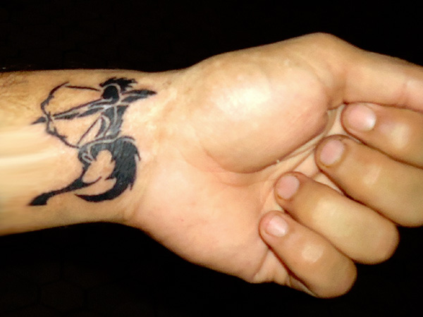 tribal sagittarius tattoo