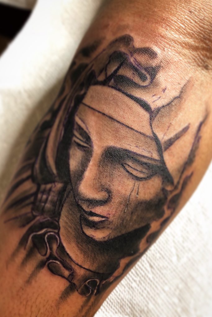 Crying virgin mary tattoo 