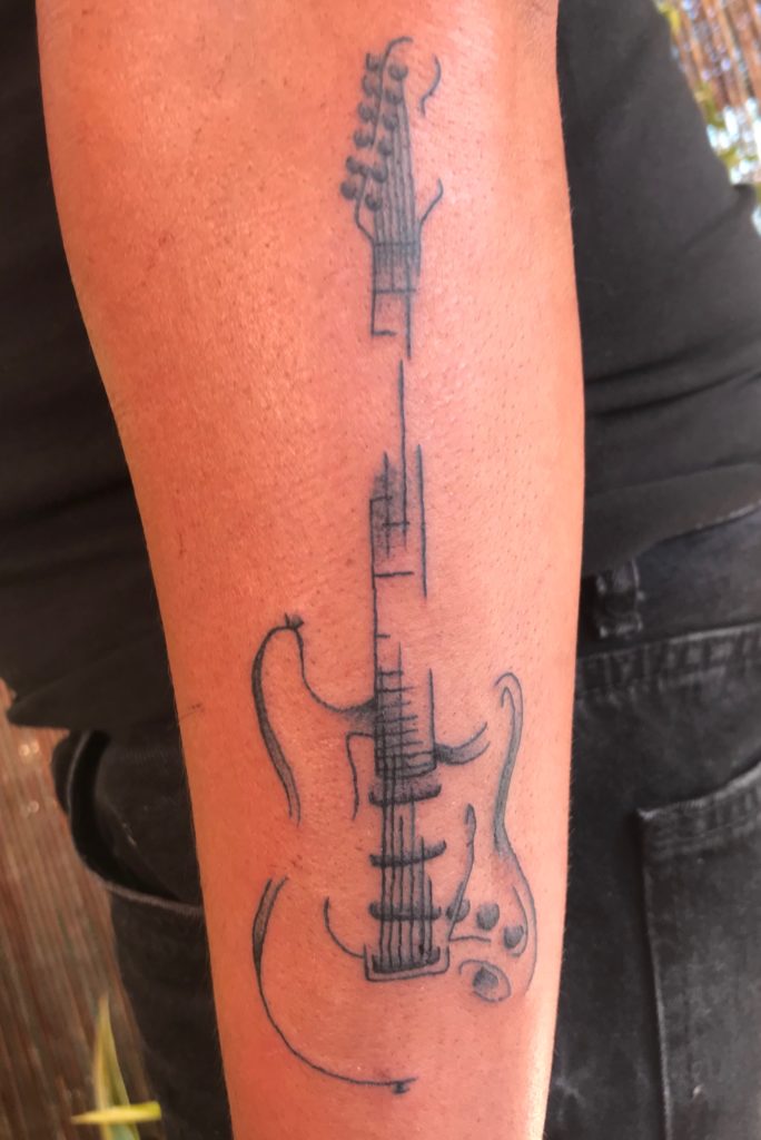 Guitar pick tattoo