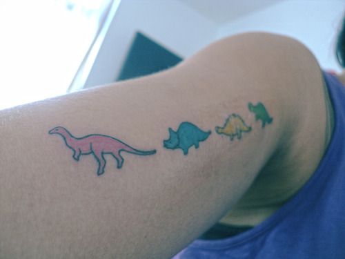 Matching dinosaur tattoos