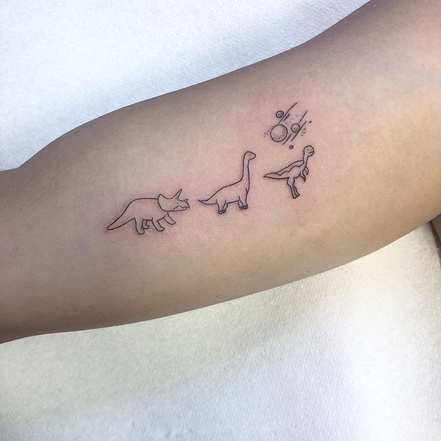 Matching dinosaur tattoos