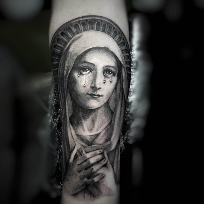 Crying virgin mary tattoo