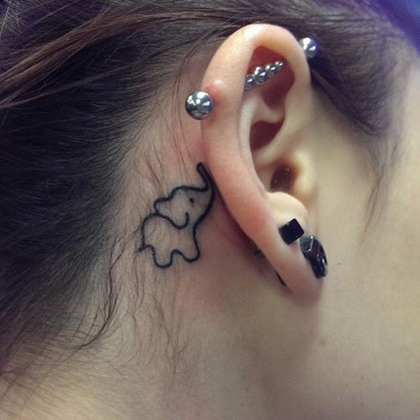 Tiny elephant tattoo 