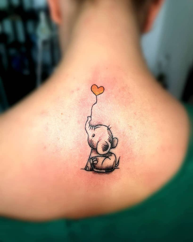 Tiny elephant tattoo 