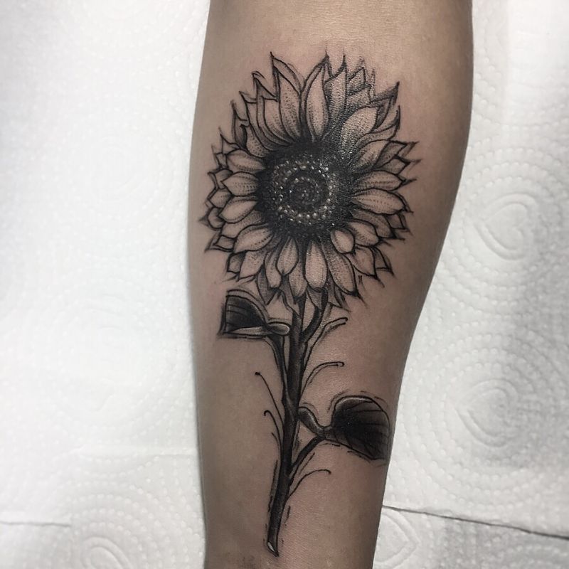 Black and grey sunflower tattoo