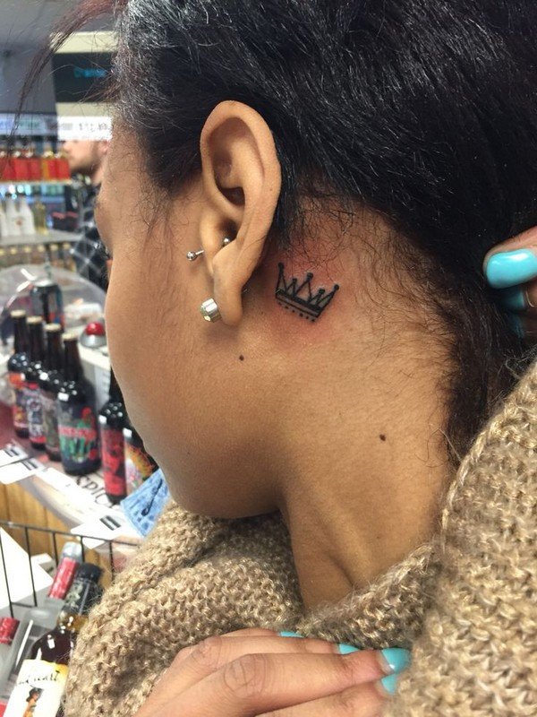 Crown tattoo behind ear