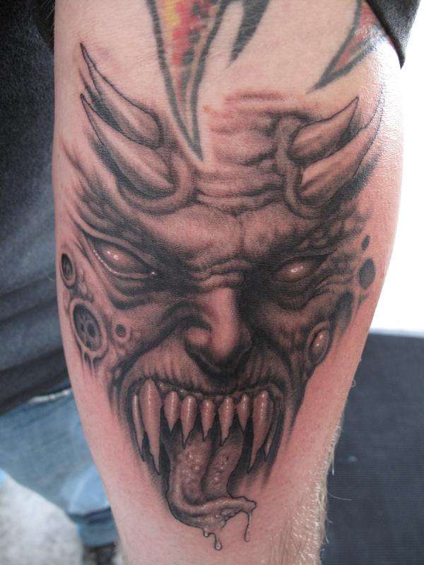 demon face tattoo