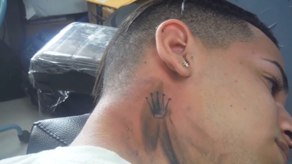 Crown tattoo behind ear