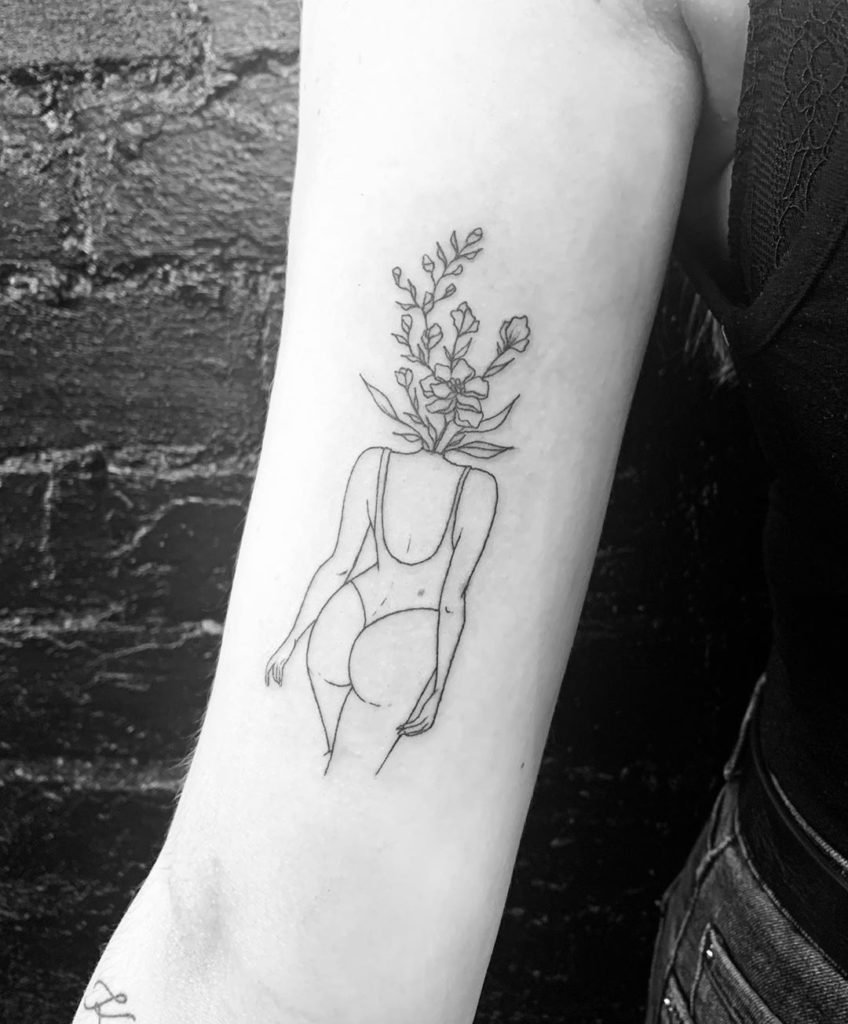 minimalist woman silhouette tattoo.