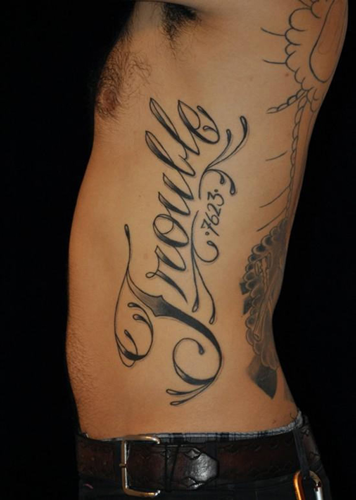 name tattoos on ribs