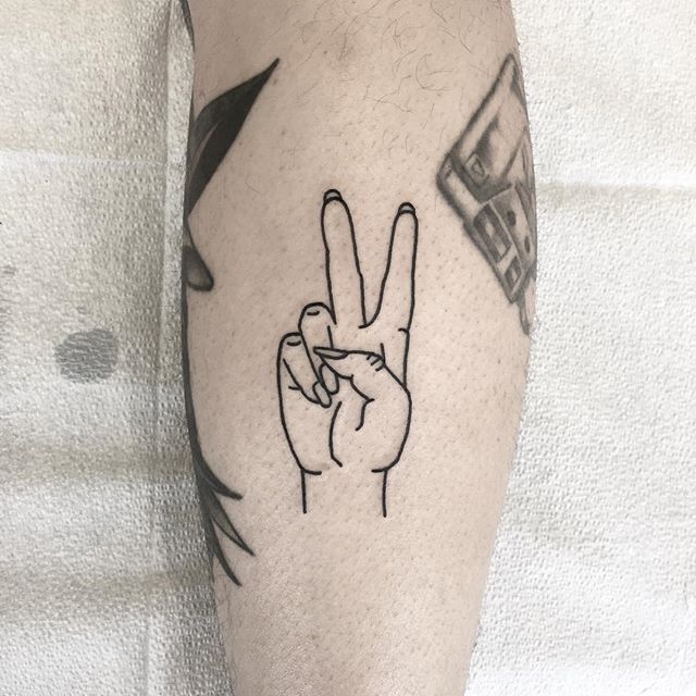 peace sign hand tattoo
