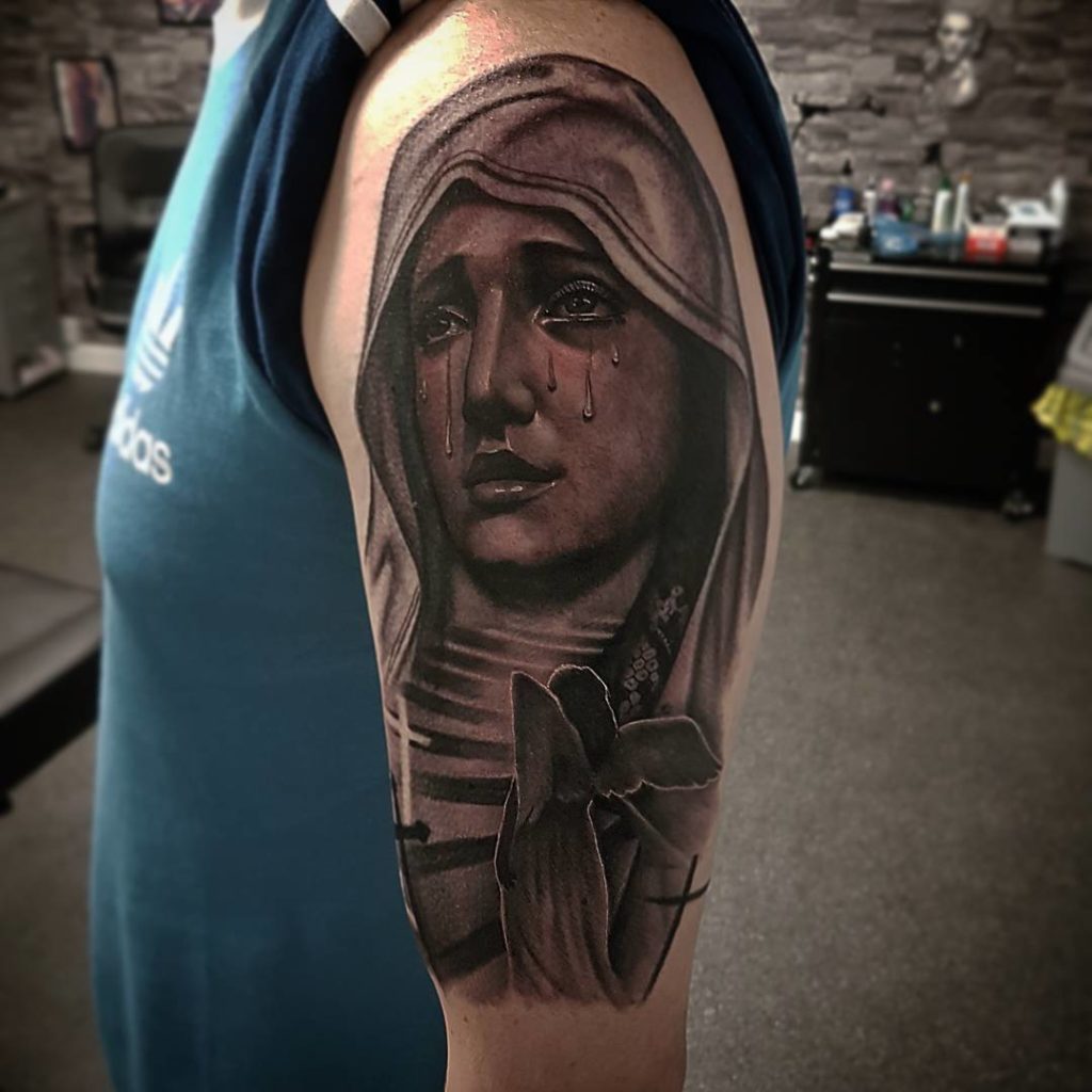 Crying virgin mary tattoo
