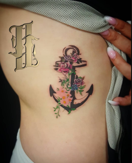 Anchor tattoo with flowers