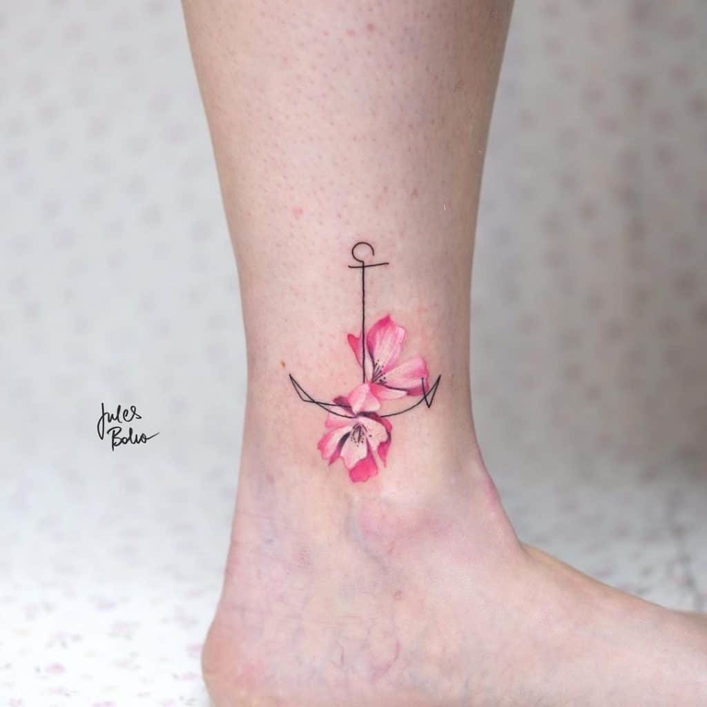 Anchor tattoo with flowers