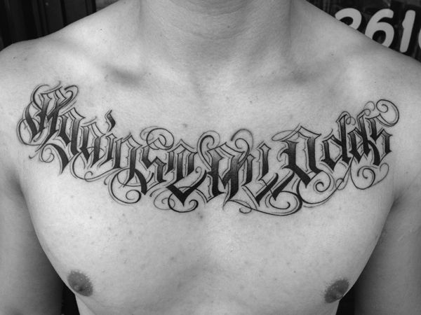 Chest lettering tattoo 