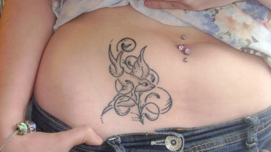 lower side stomach tattoos for females