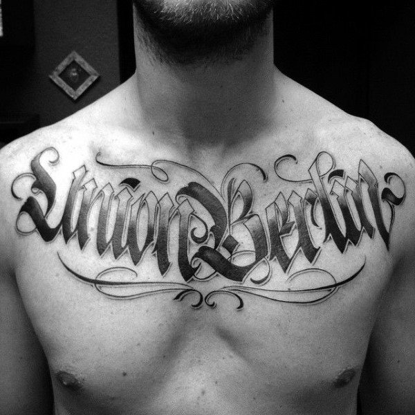 Chest lettering tattoo