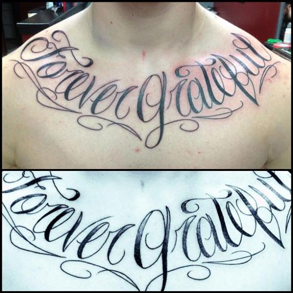 Chest lettering tattoo