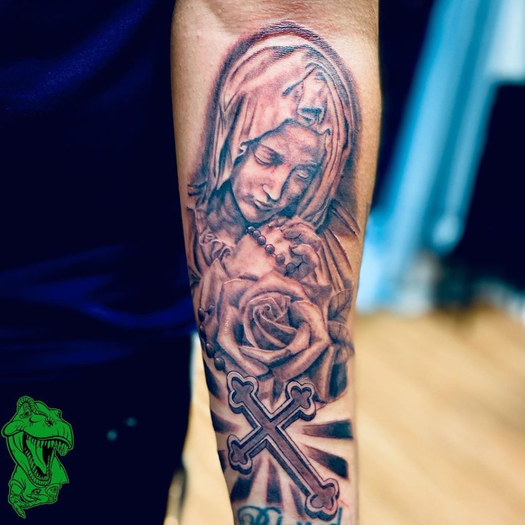 virgin mary tattoo forearm